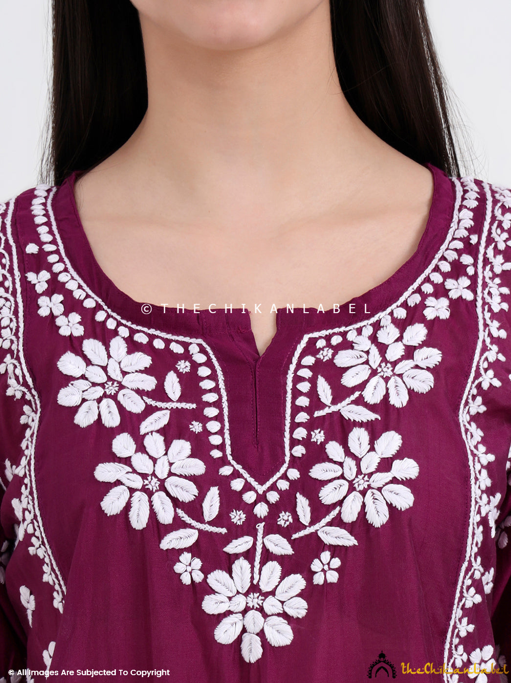 Relaxed-fit chikankari short top made from breezy chanderi, featuring side slits and classic ethnic detailing.