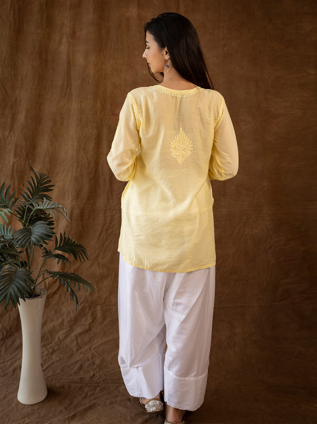 Premium hand embroidered chikankari kurti set designed with a straight silhouette and wide farshi salwar for timeless ethnic styling