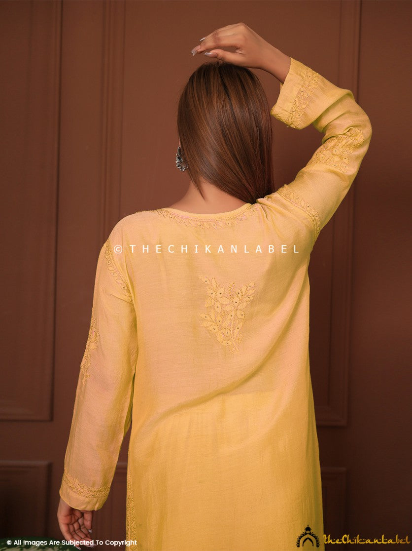 Yellow muslin kurta ensemble perfect for festive wear