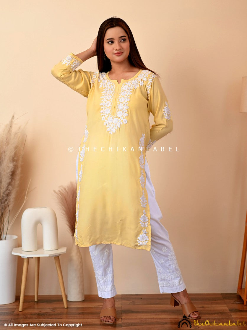 Yellow rayon straight chikankari kurti with white floral embroidery, styled for casual elegance and ethnic daywear.