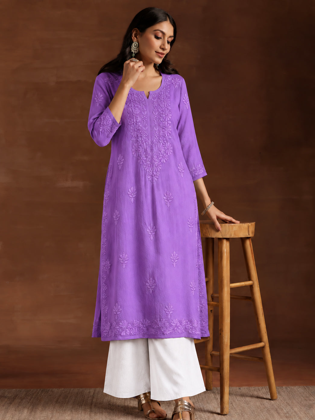 Woman modelling the Zara Rayon Straight Kurti featuring detailed floral Chikankari embroidery, a notched neckline, three-quarter sleeves and a comfortable straight fit.