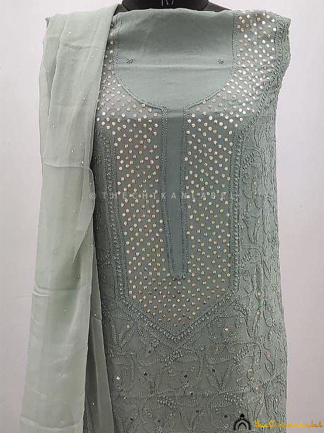 Lightweight viscose unstitched kurti set with dupatta designed with elegant mukaish work for cultural gatherings.