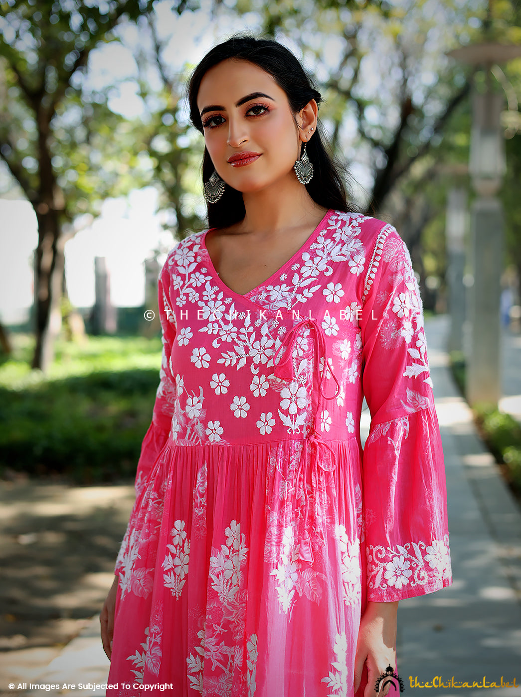 Front view of Biba pink Angrakha kurti with white embroidery