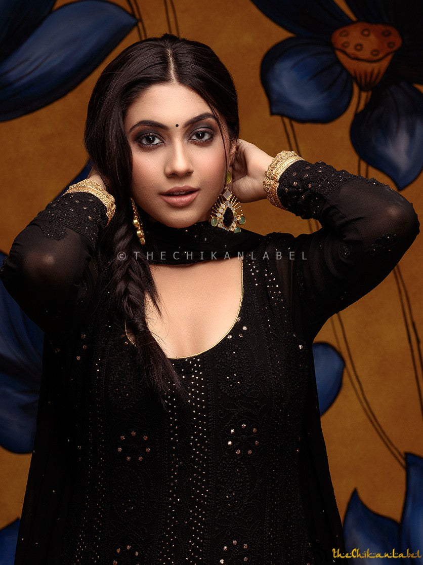 Traditional Indian Anarkali with fine chikankari and mukaish embellishments styled for a wedding event