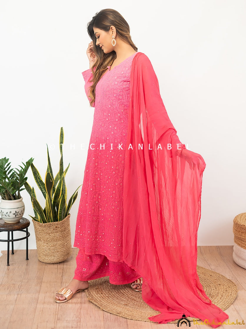 High-fashion chikankari viscose kurti palazzo outfit captured in a garden setting, ideal for elegant outdoor celebrations.