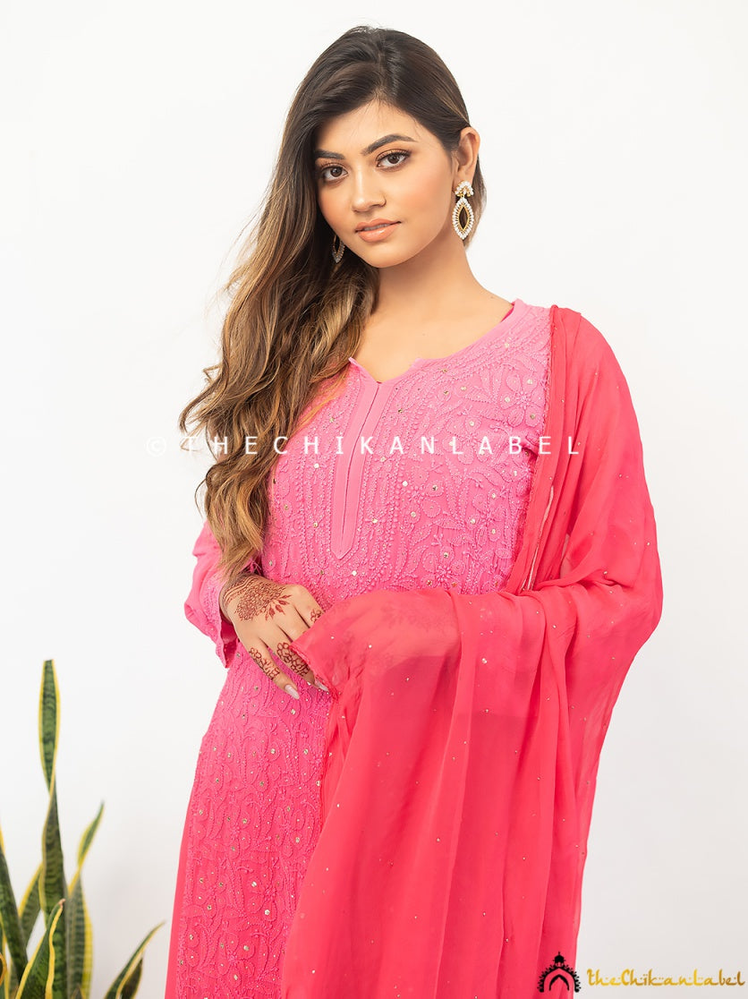 Richly embroidered chikankari kurti set in viscose with tonal palazzos and dupatta styled for traditional festivities.