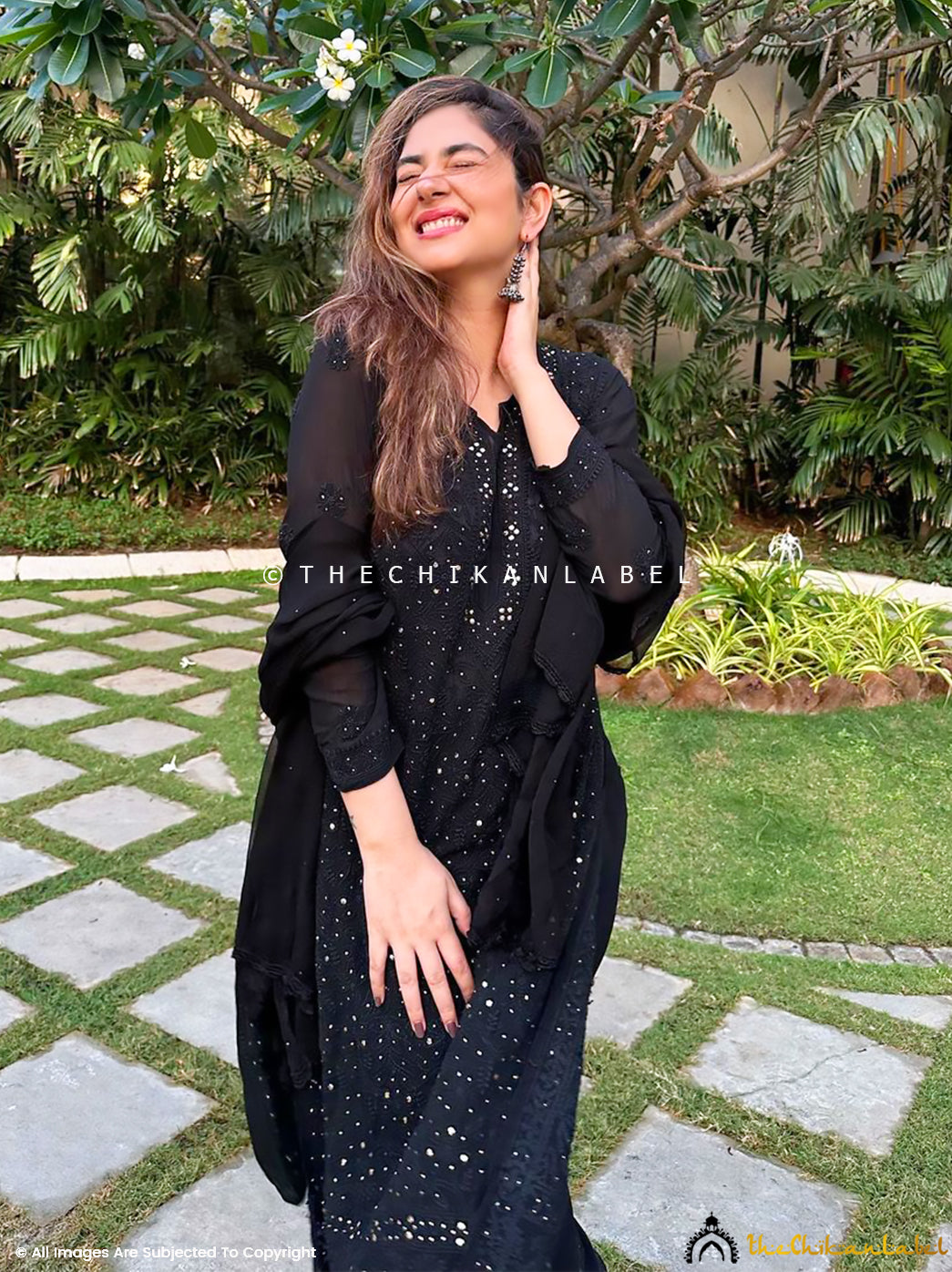 Hand-embroidered chikankari viscose kurti paired with elasticated palazzo pants and light embellished dupatta.