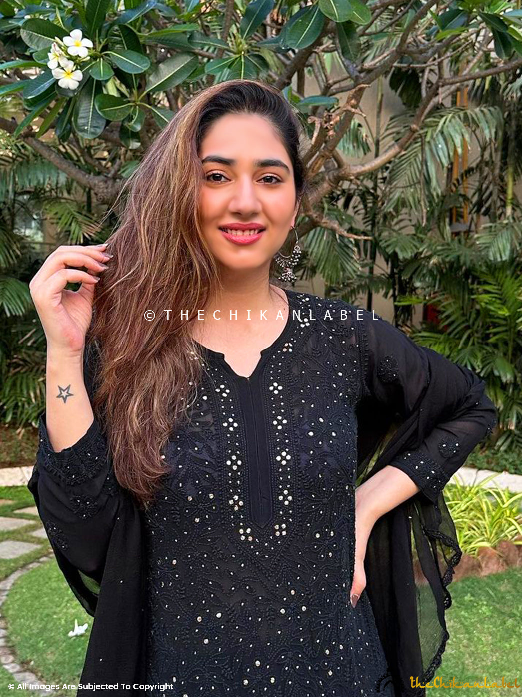 Elegant chikankari viscose kurti palazzo outfit with metallic mukaish accents, paired with a flowy dupatta for a festive look.