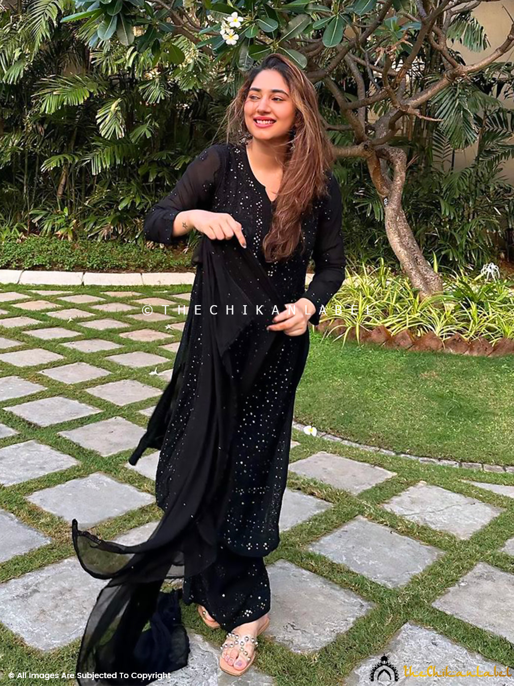 Side profile of trending viscose chikankari set with palazzo and dupatta, reflecting traditional craftsmanship in a modern silhouette.