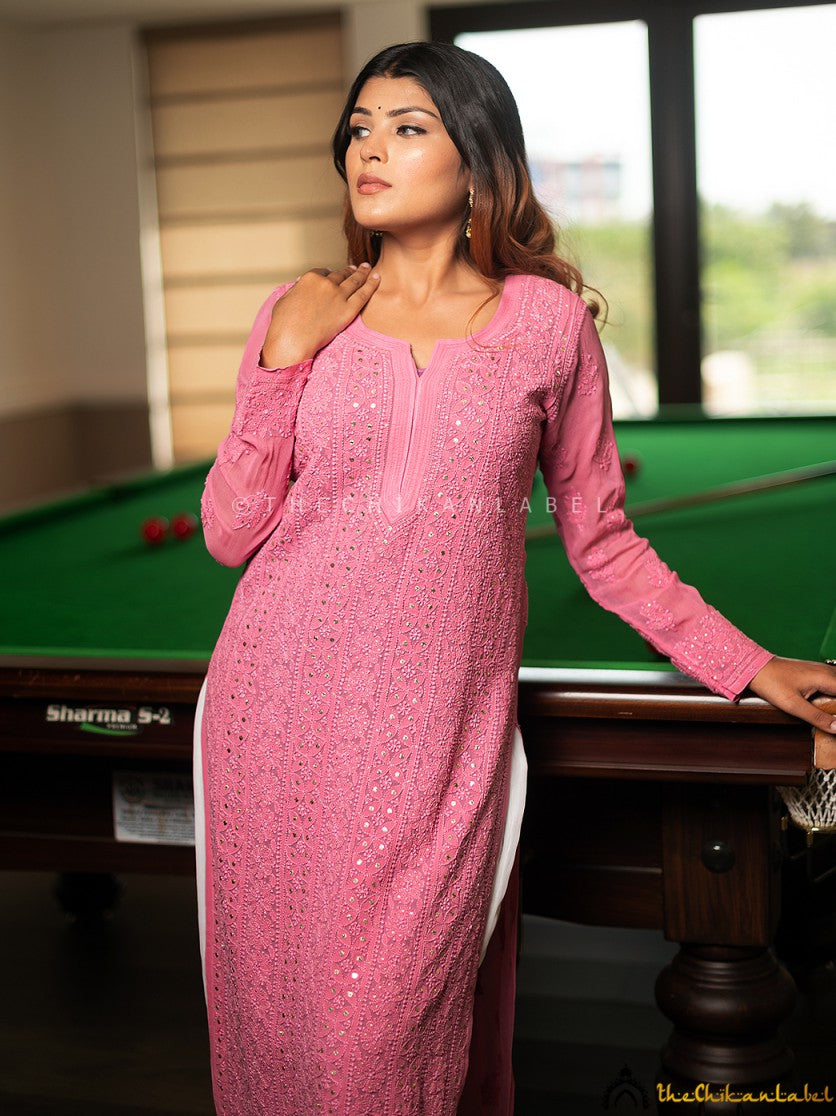 Full front view of pastel pink straight kurti styled with white trousers