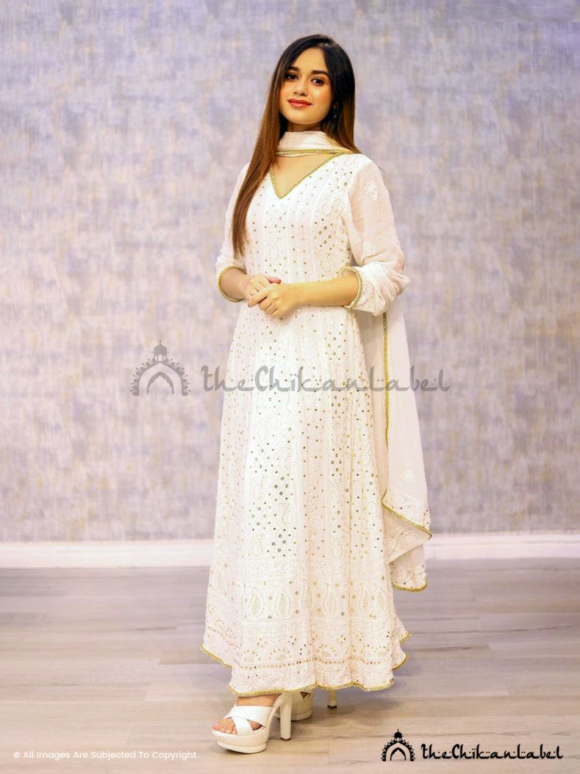 Designer mukaish Anarkali dress with rich flare and festive styling captured in natural light