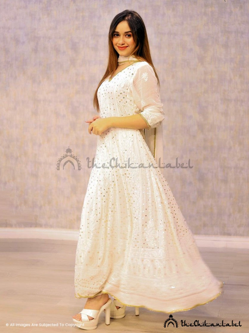 Heavy embroidered chikankari Anarkali styled with bridal jewelry and ethnic makeup for wedding inspiration