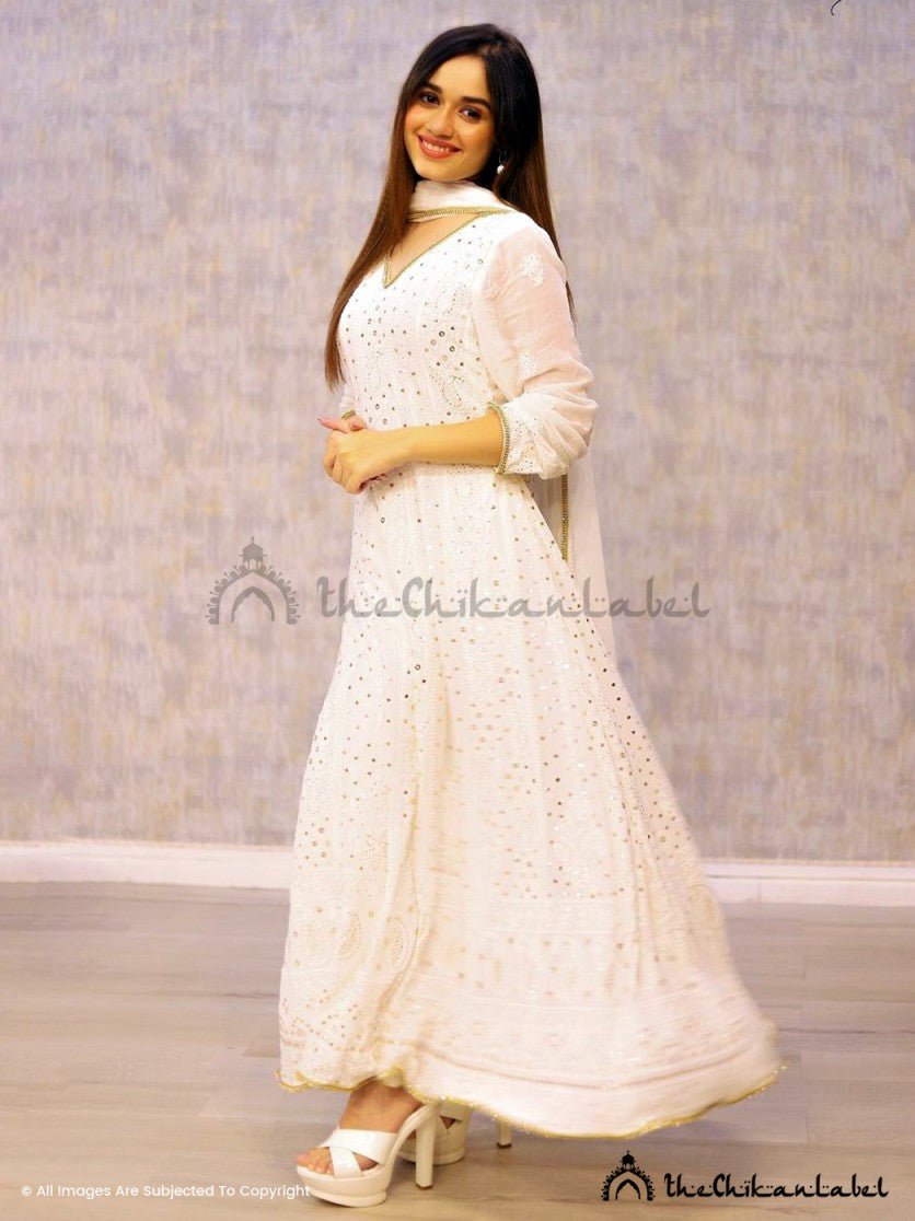 Stylish festive wear Anarkali captured with floral decor in a rooftop evening celebration setup
