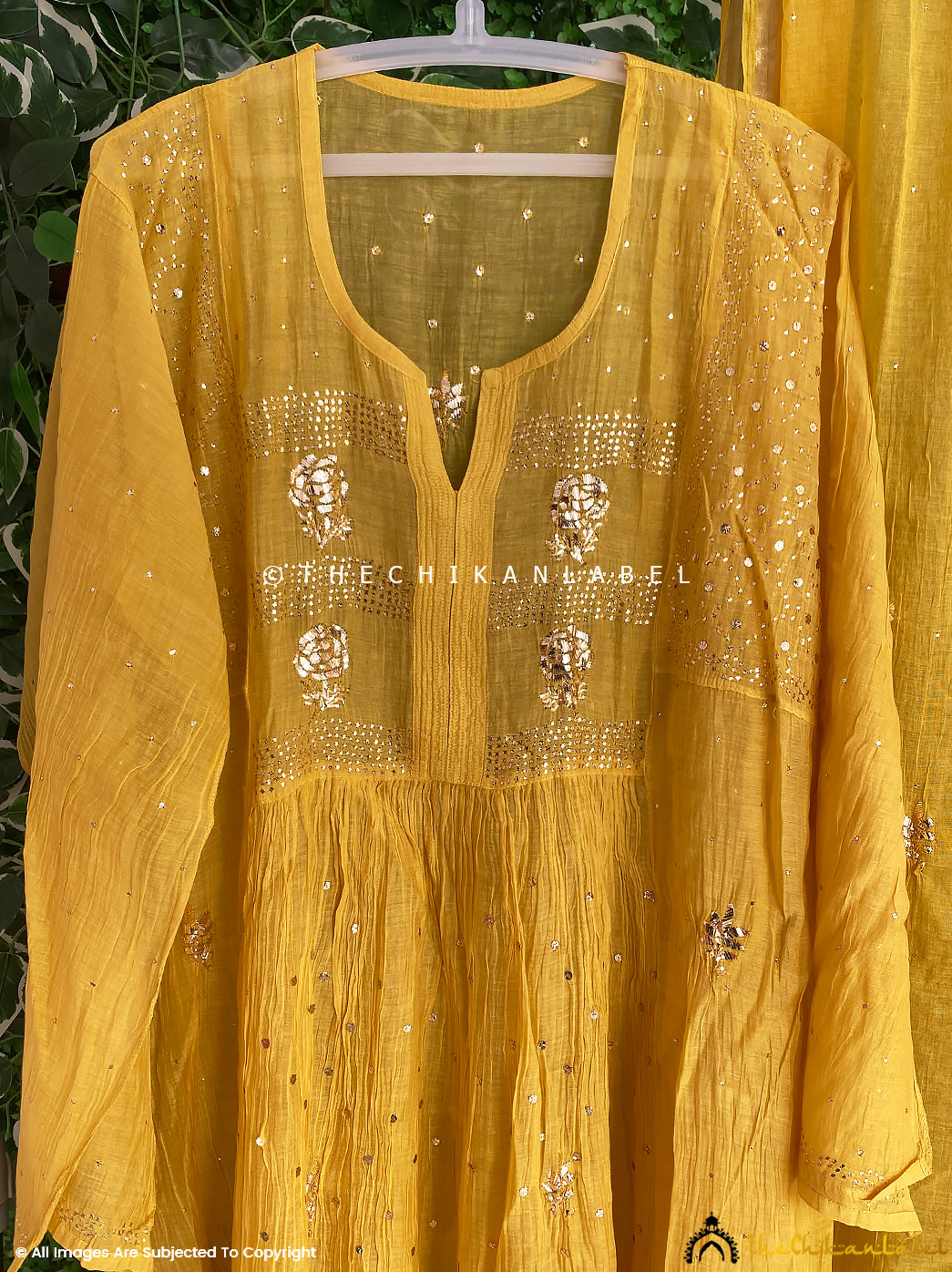 Luxe chikankari Anarkali kurti material crafted from soft Mulmul Chanderi fabric paired with matching dupatta and ornate neckline embroidery