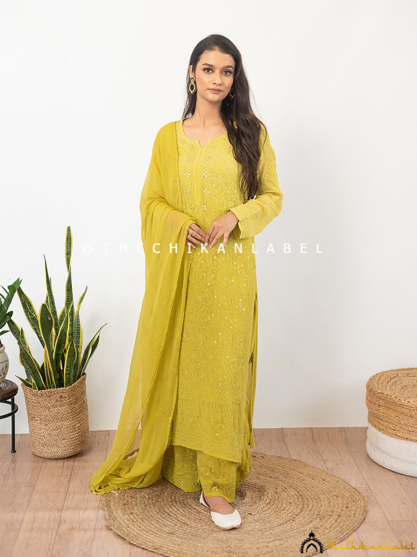 Viscose fabric ethnic set with delicate chikankari and mukaish embroidery worn with strappy heels and statement earrings.