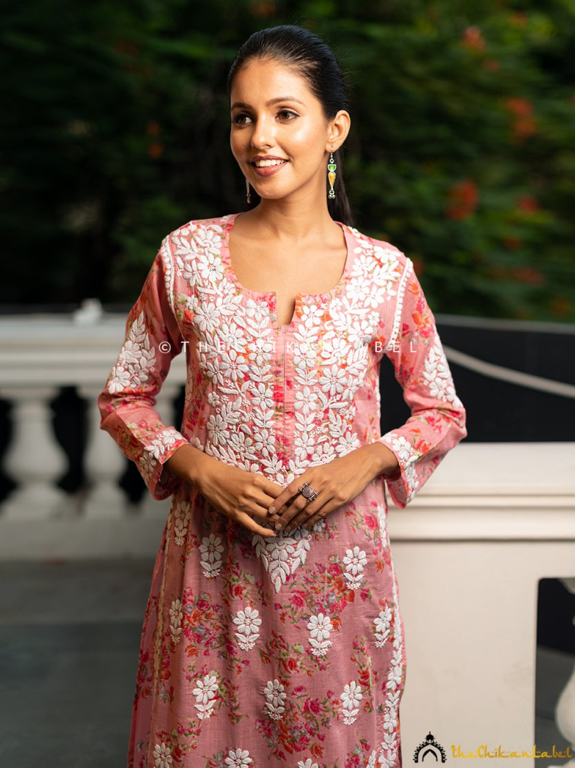 The kurti features a straight-fit silhouette and elegant three-quarter sleeves.