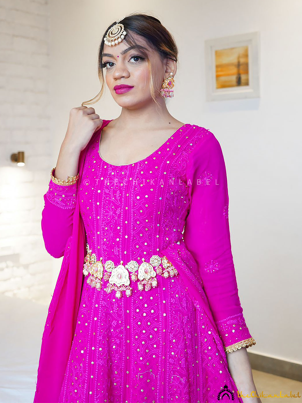 Full-length viscose Chikankari Anarkali suit styled with traditional jewelry for wedding wear look