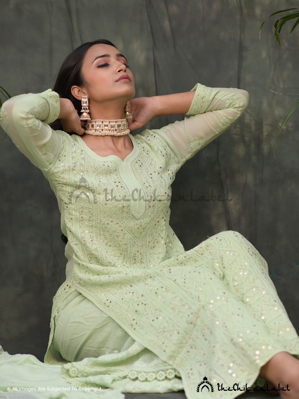 Model in pastel green chikankari suit set with sheer dupatta