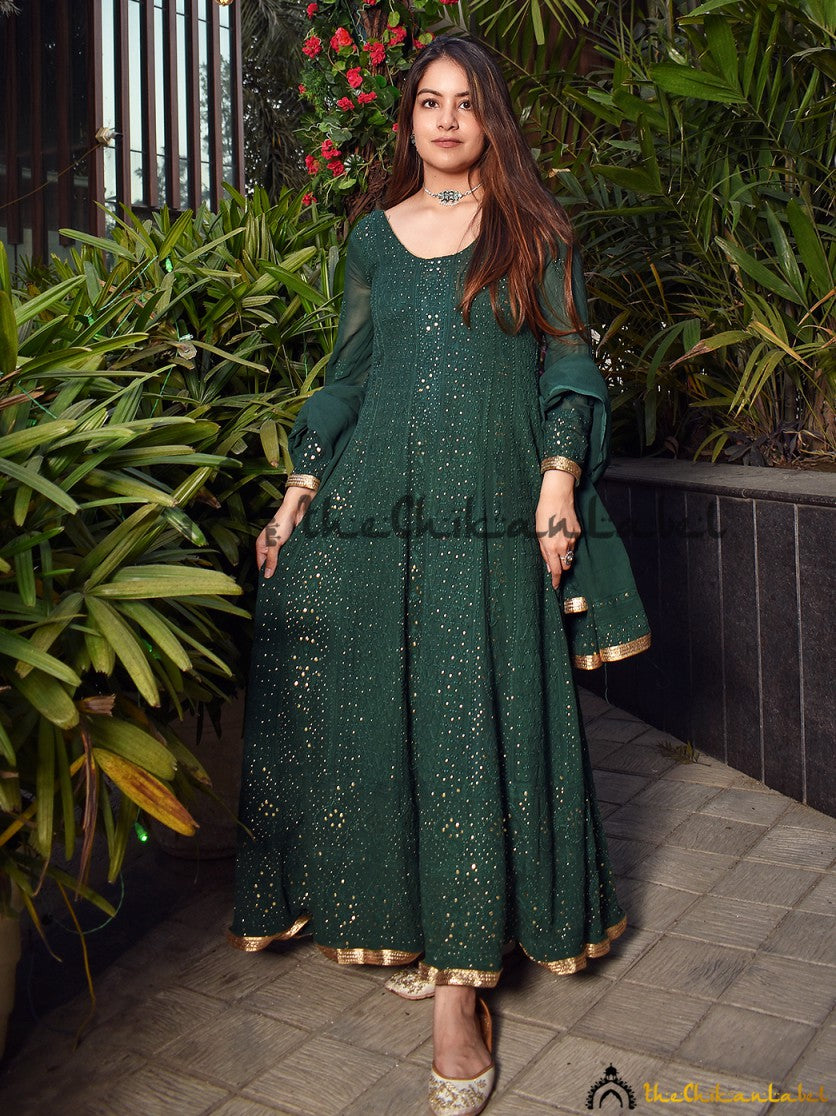 Artisanal mukaish Anarkali paired with classic Indian accessories in an outdoor festive setting