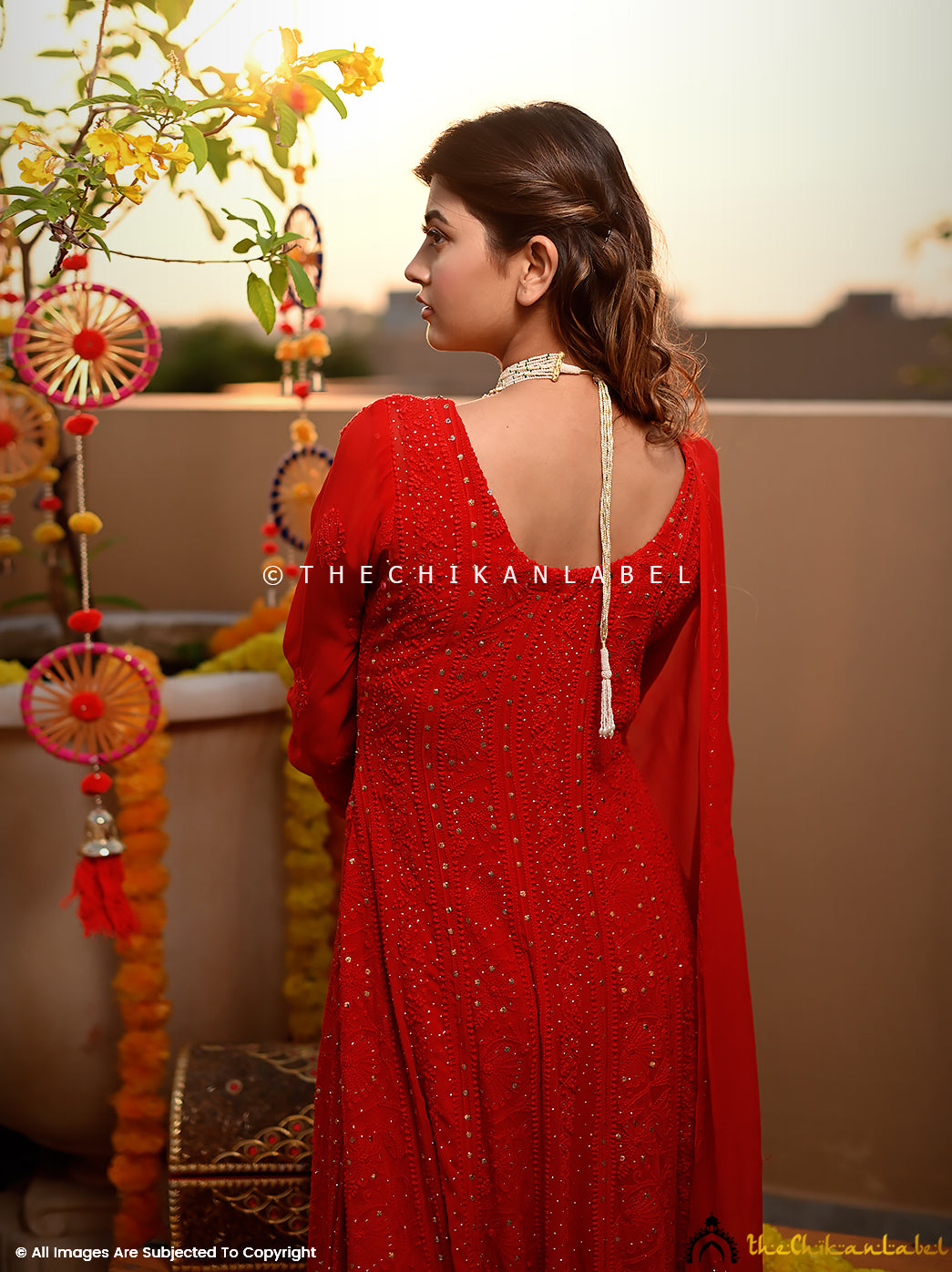 Designer mukaish Anarkali dress with rich flare and festive styling captured in natural light