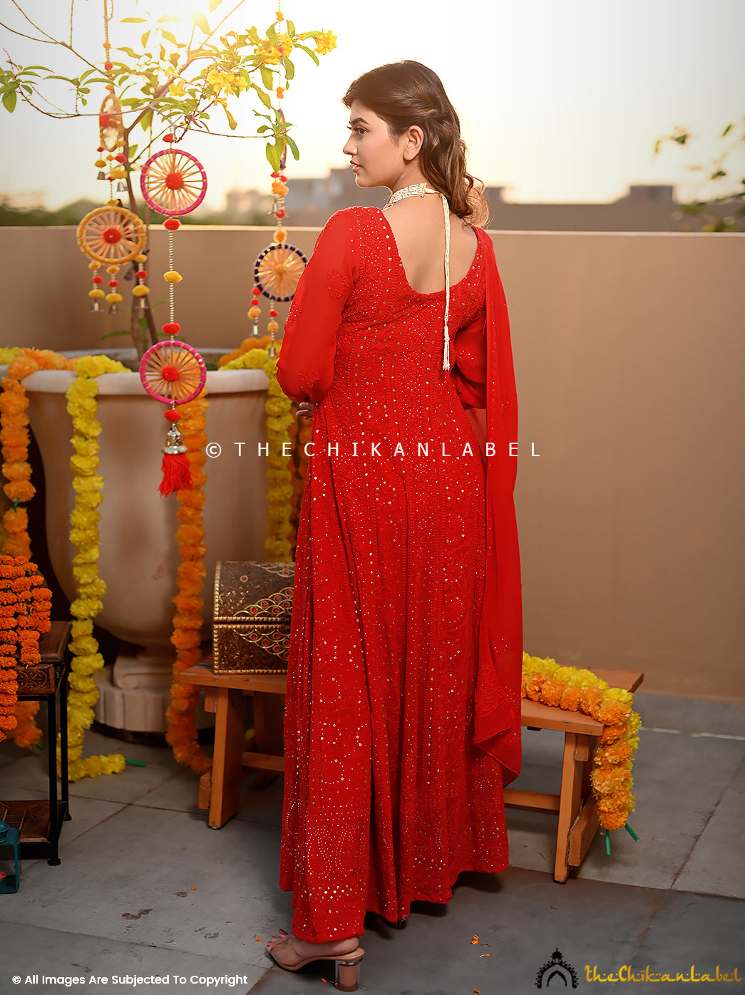 Model showcasing luxe Chikankari Anarkali outfit with embroidered dupatta for grand celebrations