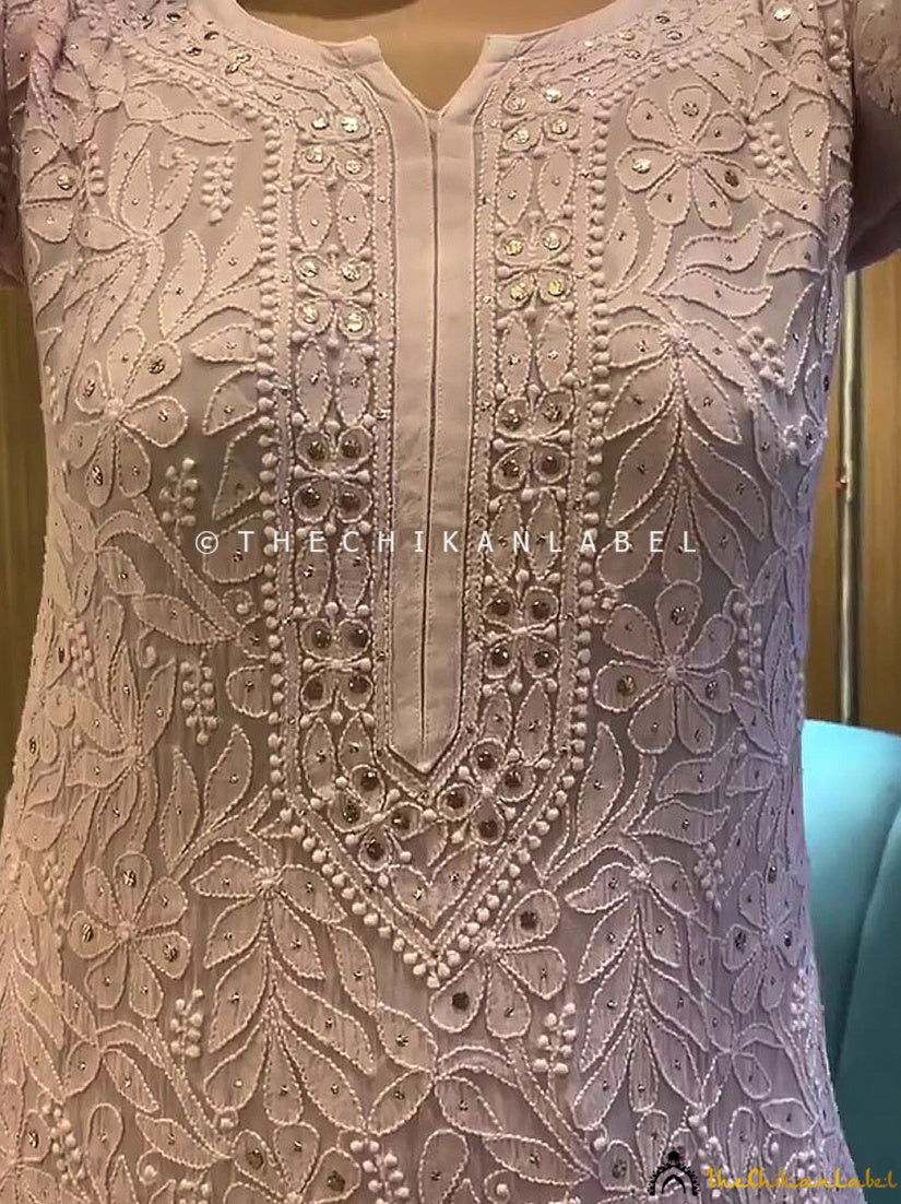 Traditional mukaish and chikankari work on viscose kurti set worn for ethnic gatherings and weddings.