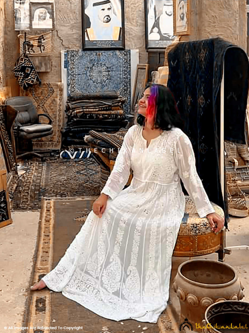 White flowy chikankari Anarkali with full sleeves and hand embroidery, captured in ambient lighting