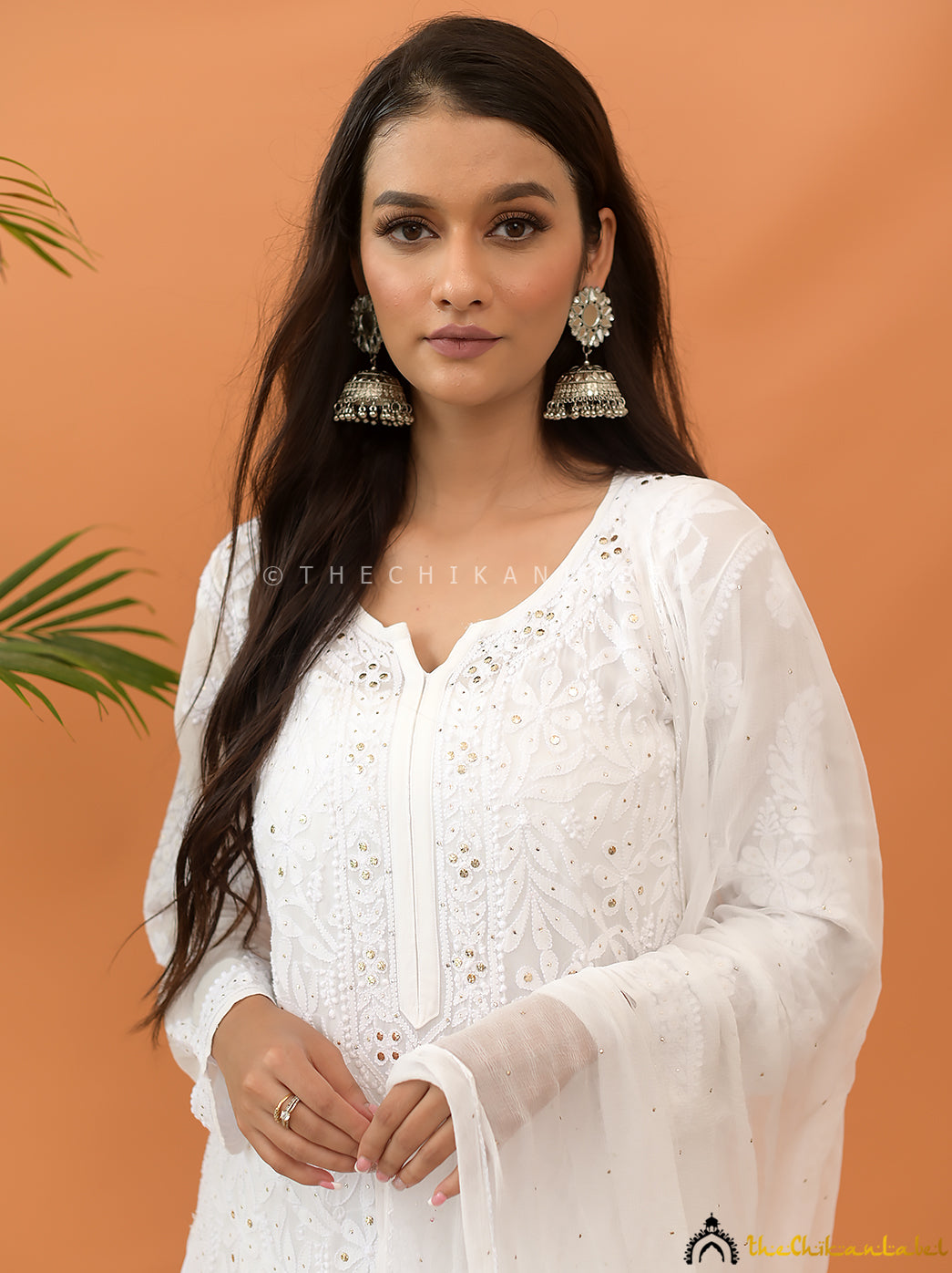 Trending viscose chikankari set with detailed hand embroidery and shimmer mukaish highlights for a wedding-ready look.