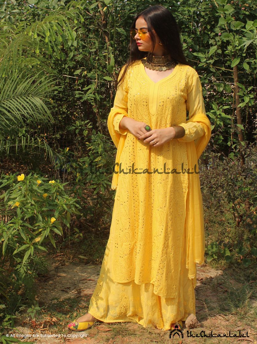 Woman in yellow chikankari viscose kurta set with dupatta