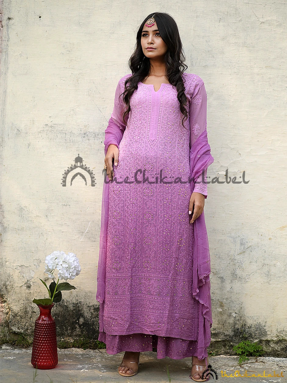 Woman wearing purple chikankari kurta set with mirror work and dupatta