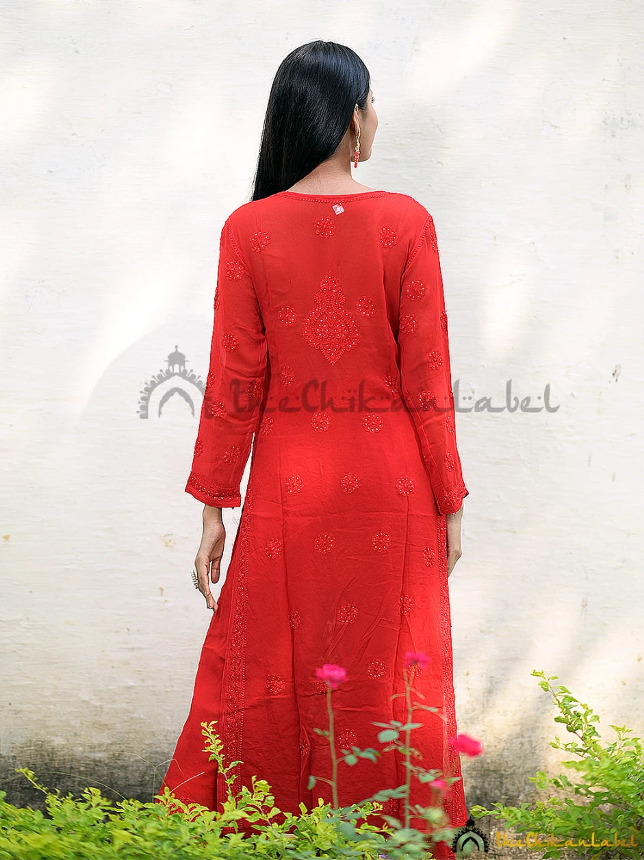 Back view showing straight silhouette and flow of red chikankari kurta set.