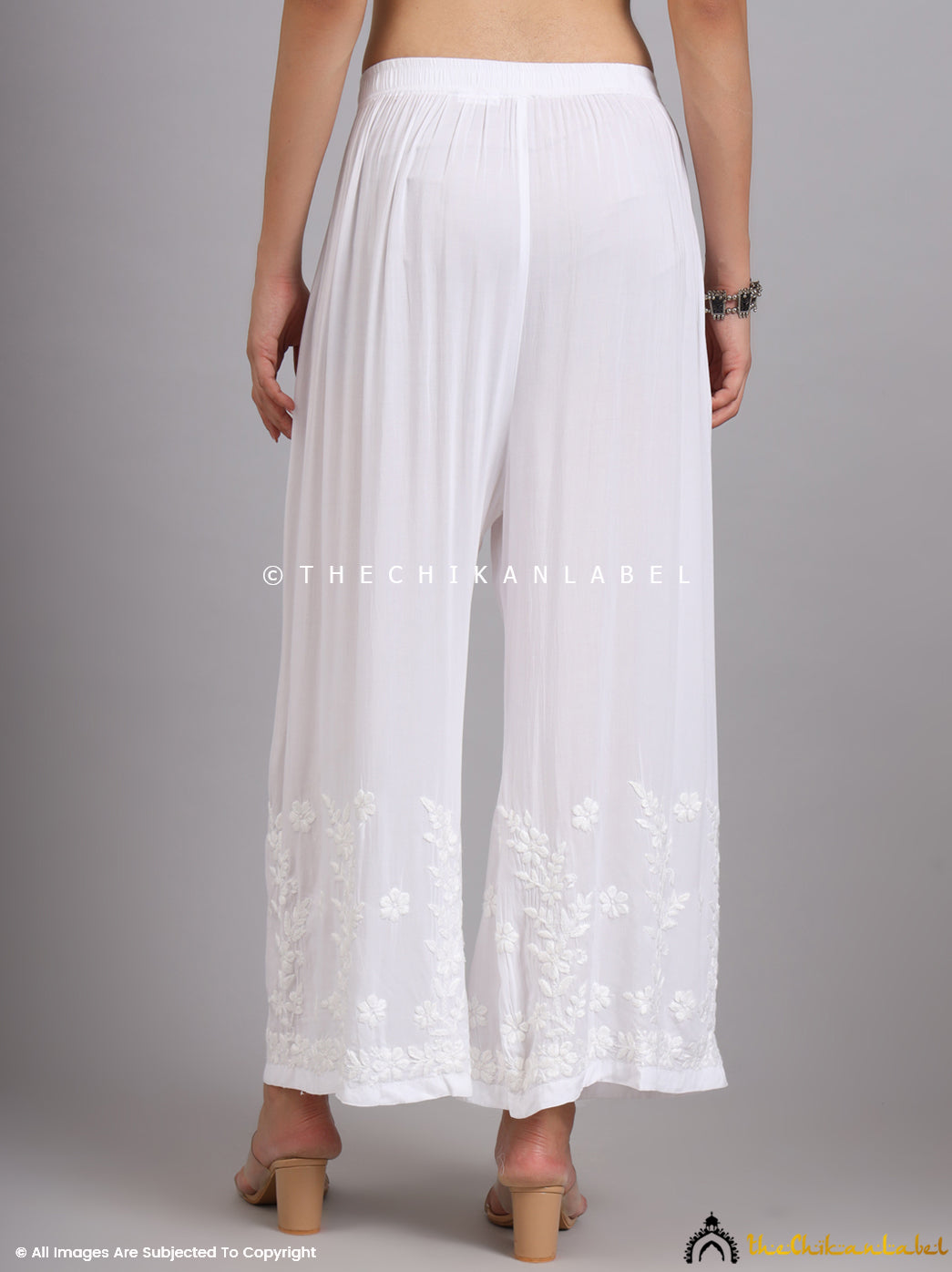Traditional embroidery on white palazzo pants
