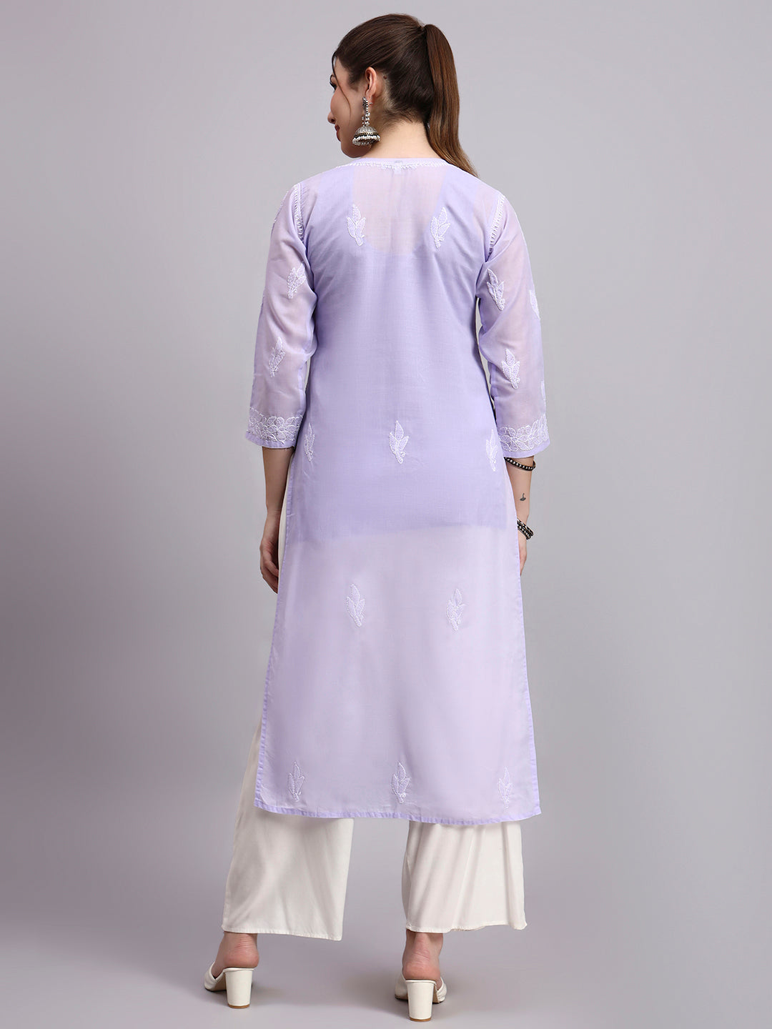 Trending women kurta with classic embroidery and straight fit design suitable for office and daily wear