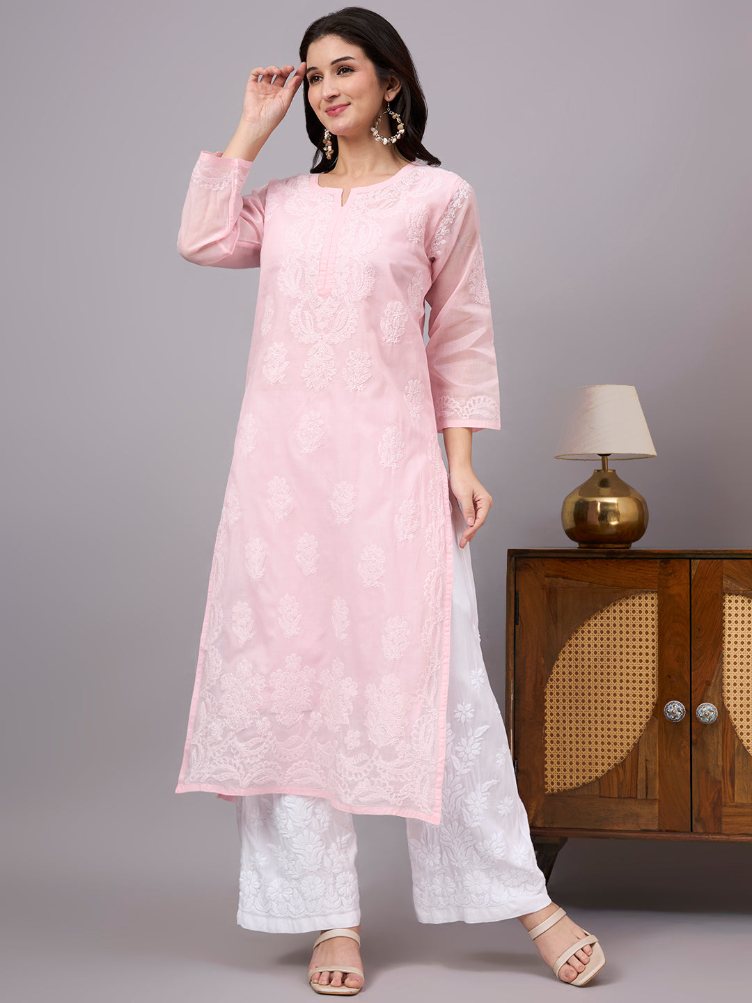 Women's handcrafted Cotton Straight Kurti with authentic floral Chikankari embroidery, comfortable regular fit, and breathable fabric for daily wear and festive occasions.
