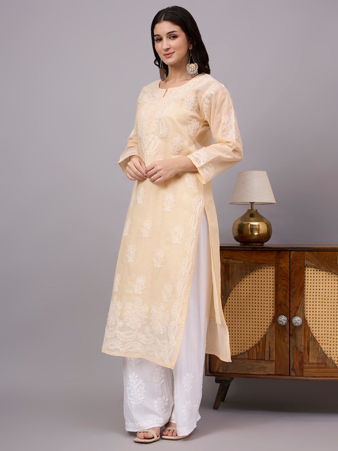 Women's handcrafted Cotton Straight Kurti with authentic floral Chikankari embroidery, comfortable regular fit, and breathable fabric for daily wear and festive occasions.