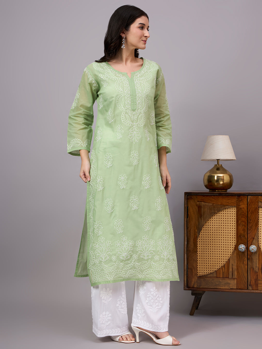 Women's handcrafted Chikankari Kurta made from breathable cotton fabric with detailed artisan embroidery and a comfortable regular fit for every occasion.