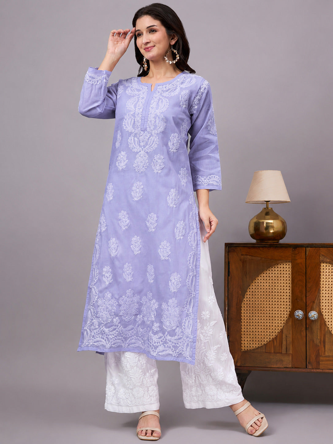 Women's handcrafted Cotton Straight Kurti with authentic floral Chikankari embroidery, comfortable regular fit, and breathable fabric for daily wear and festive occasions.