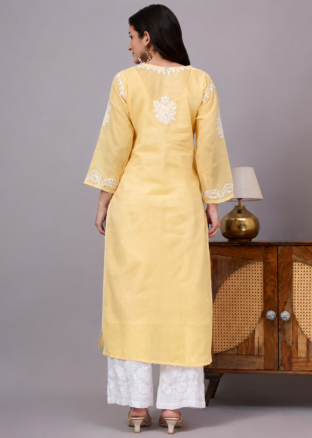 Women's trending kurti featuring handcrafted Lucknow Chikankari embroidery, premium cotton construction, soft inner lining, and elegant straight-fit styling.