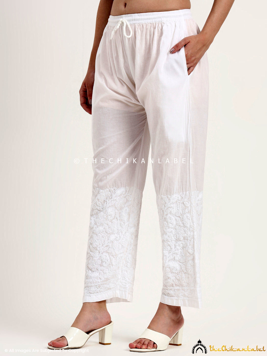 Women’s chikankari palazzo pants showcasing artisan embroidery from Lucknow for ethnic outfits.
