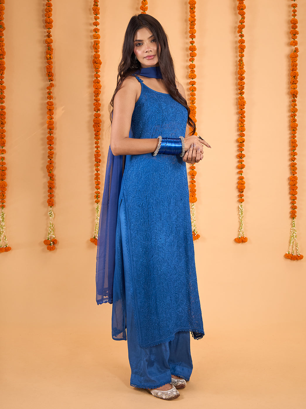 Model displaying the straight silhouette of the Adaah viscose strappy kurti, paired with relaxed palazzo pants and a dupatta draped around the neck.