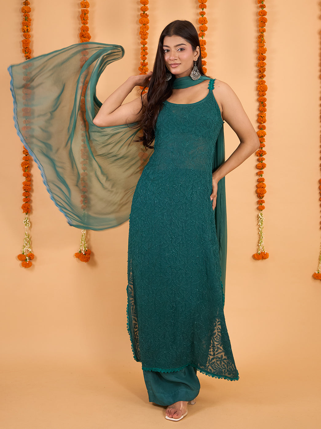 Front view of the Adaah strappy Chikankari kurta showing dense floral embroidery, a softly curved neckline and lace trim along the lower hem.