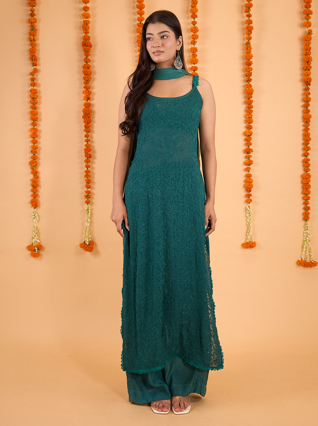 Full-length Adaah Chikankari kurta set with dupatta, showing embroidered straps, side slits and fine lace detailing around the kurti hem.
