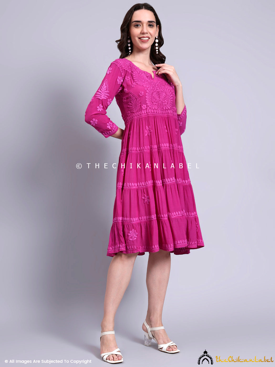 Designer chikankari crepe tunic featuring delicate floral motifs and full-length sleeves.

