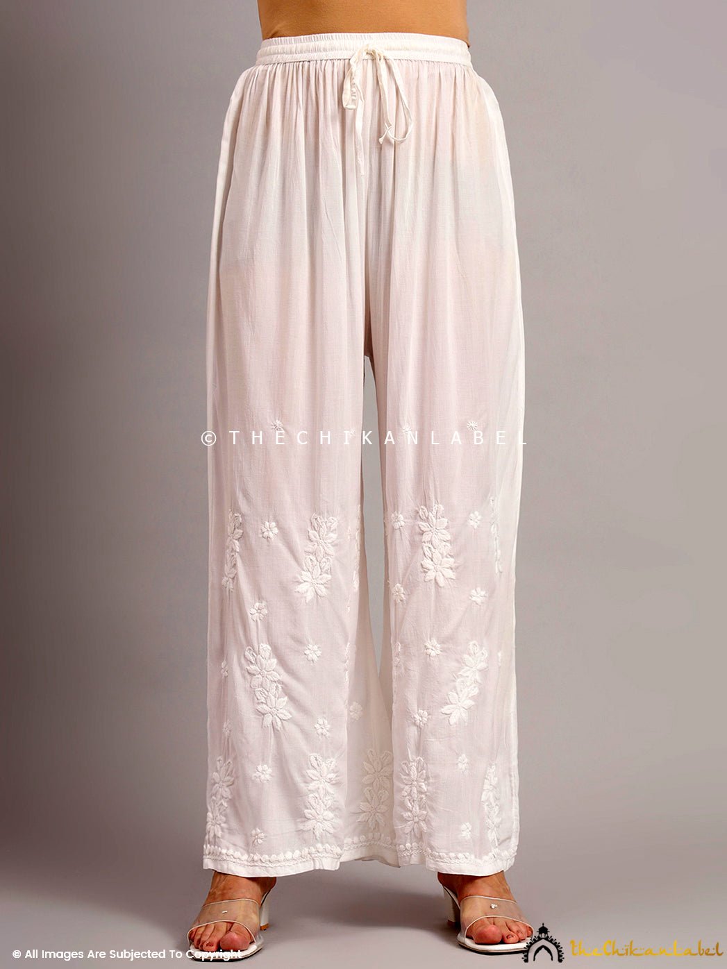 Straight fit modal palazzo pants designed with delicate chikankari embroidery, paired with a short kurti for a balanced ethnic look

