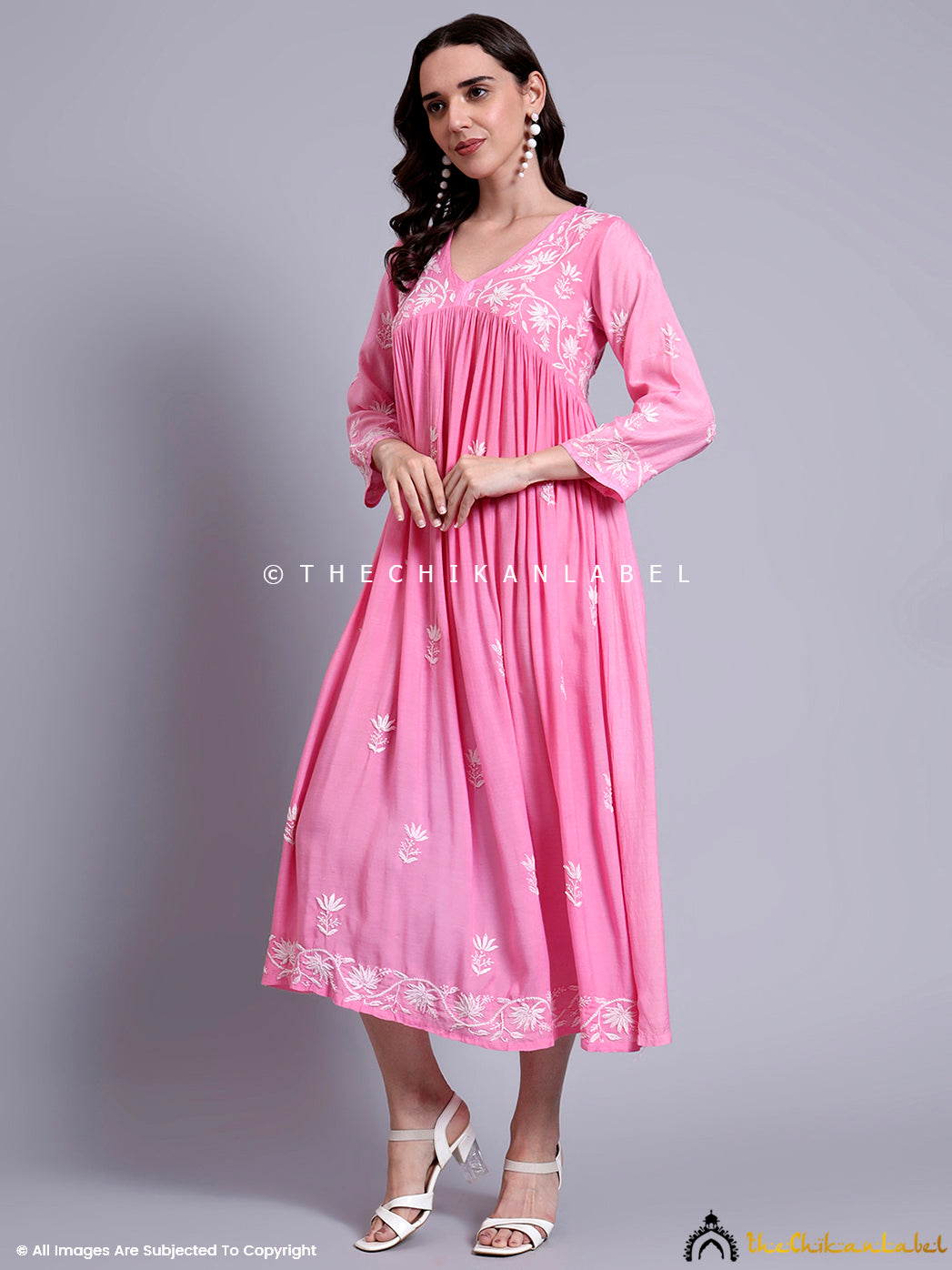 Ethnic muslin Anarkali dress featuring flowing silhouette and artisan embroidery on yoke and hem.

