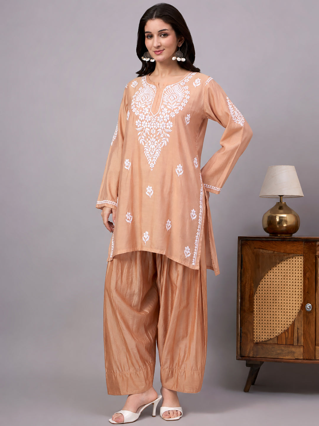 Trending farshi set for women with detailed Chikankari embroidery, long sleeves, straight kurta design and coordinated relaxed farshi-style bottoms.