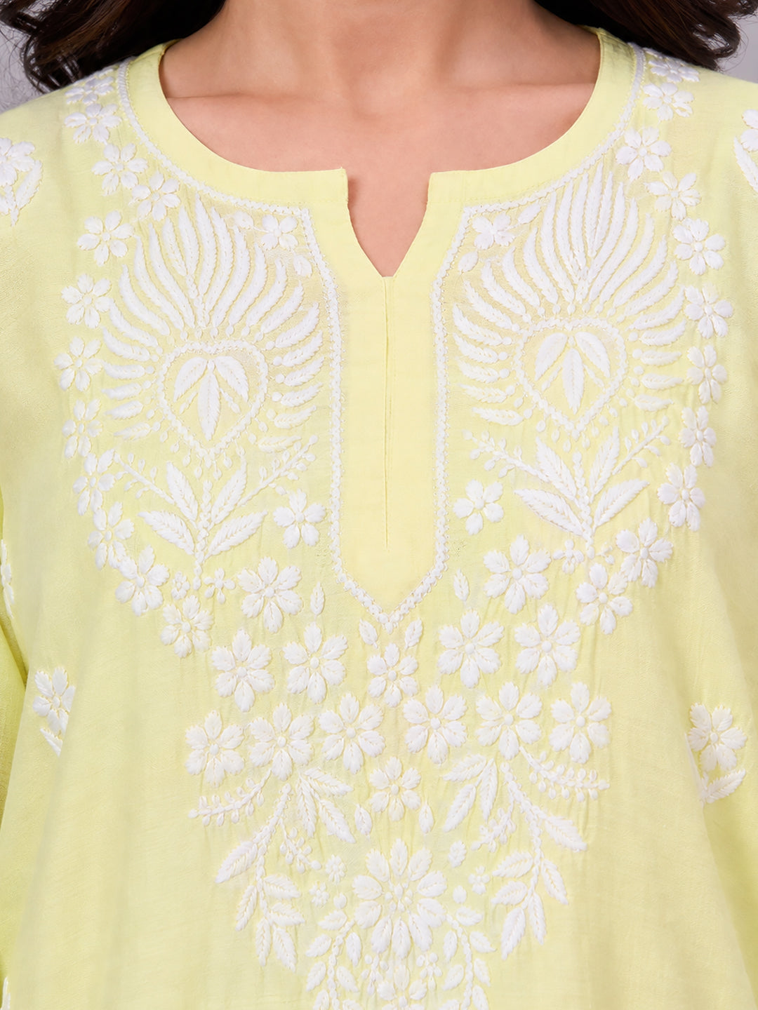 Stylish Chikankari farshi set for women with embroidered neckline detailing, floral motifs and an easy-flowing farshi bottom suitable for all-day wear.