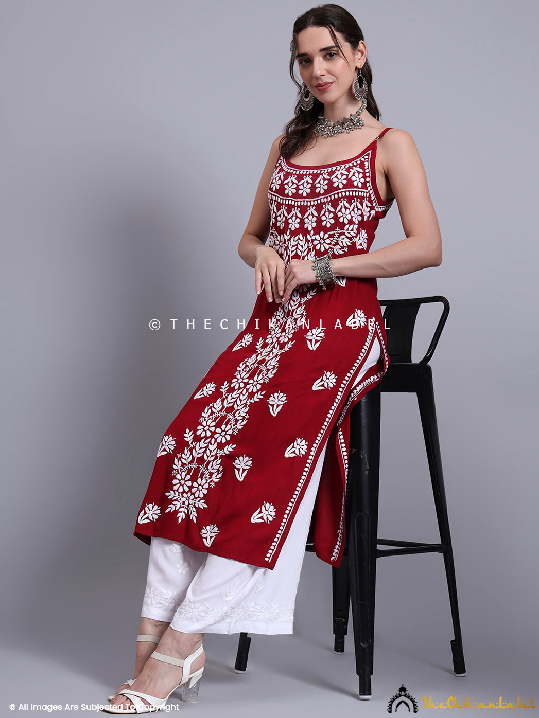 Close-up of handcrafted embroidery on modal kurta with straight cut and sleeveless styling, ideal for festive and casual occasions.

