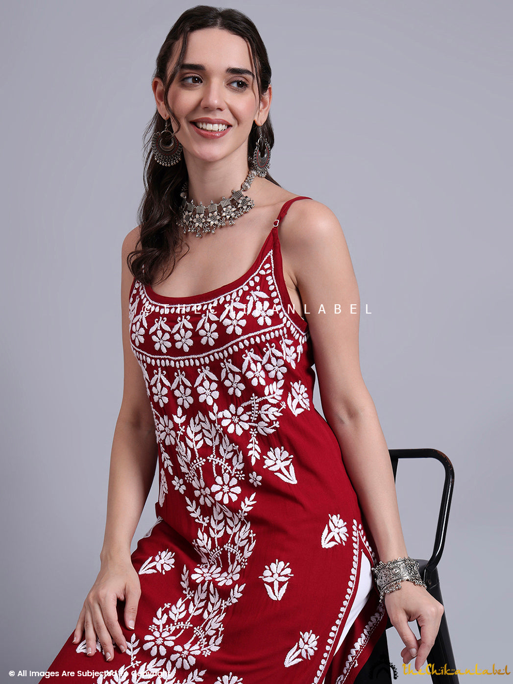 Hand-embroidered chikankari kurta in modal fabric with lightweight feel and boho-chic strappy neckline, paired with ethnic footwear.

