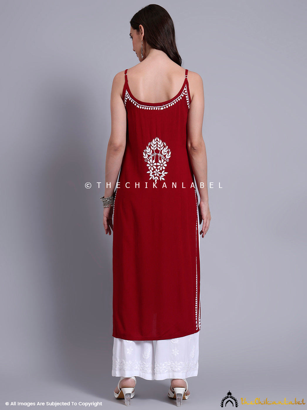 Indo-fusion outfit featuring a strappy chikankari kurta in soft modal with floral threadwork, styled for summer events and casual outings.

